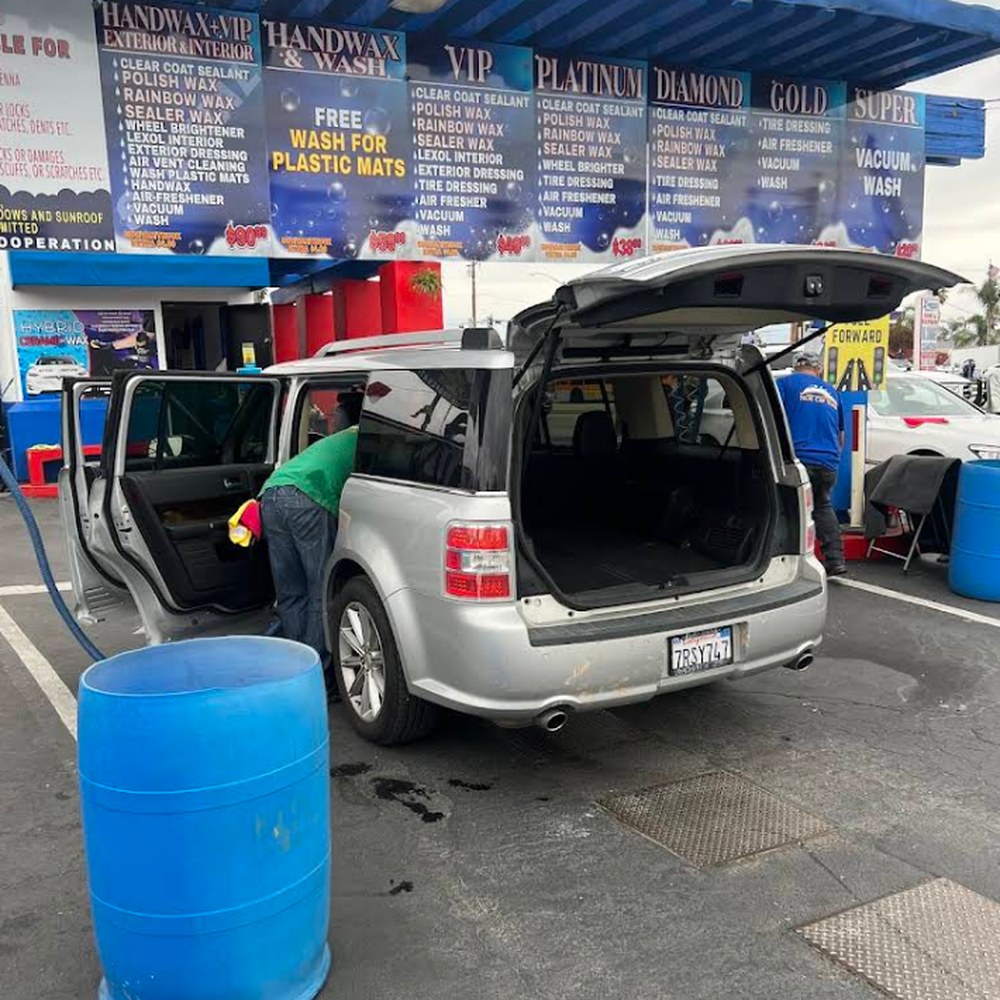 Crew detailing the interior of a Ford Flex at SuperKleen